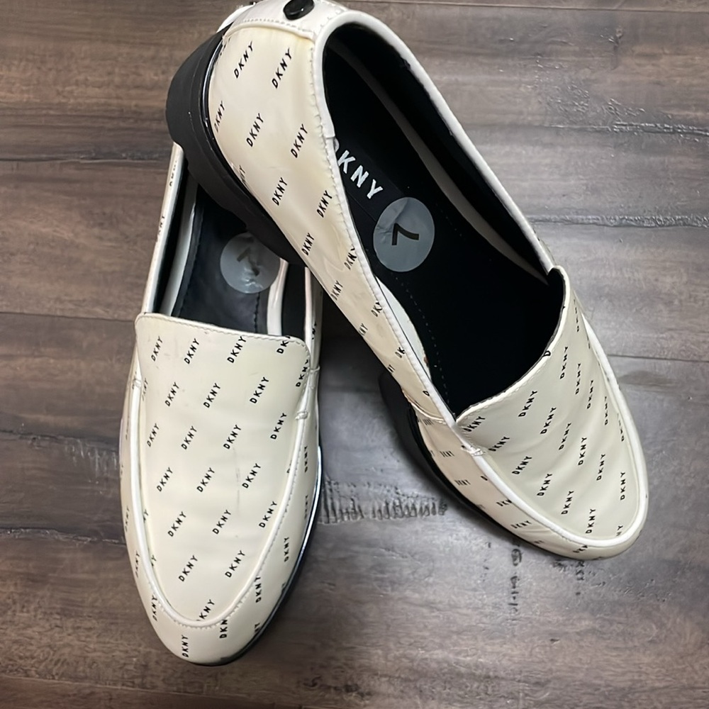 Slightly used  DKNY Logo White Platform Slip-on  Shoes. US sz. 7